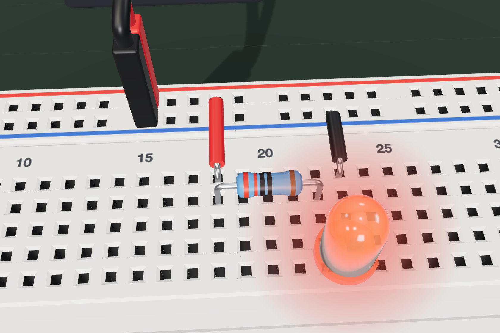 The finished first circuit: a 5 V supply, a resistor and a lit red LED